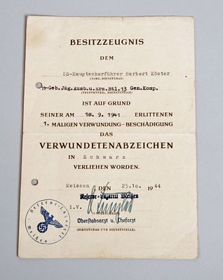 GERMAN WWII SS BLACK WOUND BADGE CITATION TO HERBERT KOSTER.