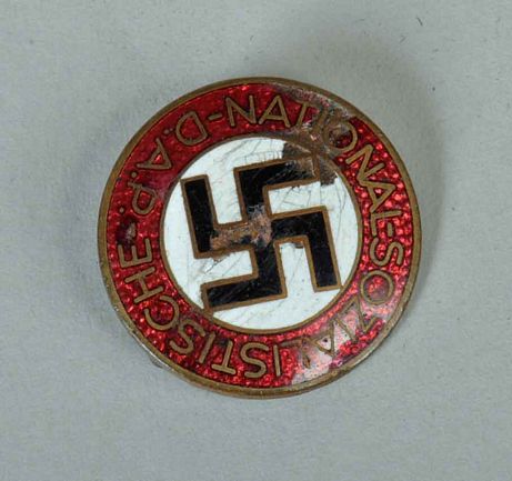 GERMAN WWII NSDAP MEMBERSHIP BADGE WITH SLIGHT DAMAGE.