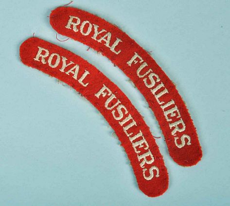 BRITISH WWII 12TH BATTALION ROYAL FUSILIERS SHOULDER TITLE.