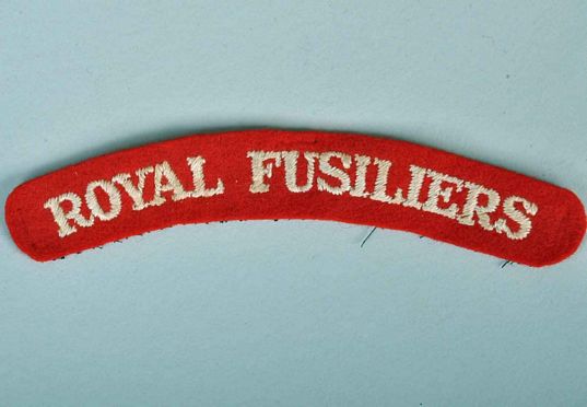BRITISH WWII ROYAL FUSILIERS SHOULDER TITLE.