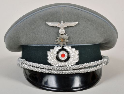 GERMAN WWII TRANSPORT ATTACHED TO A MOUNTAIN UNIT OFFICERS VISOR CAP.