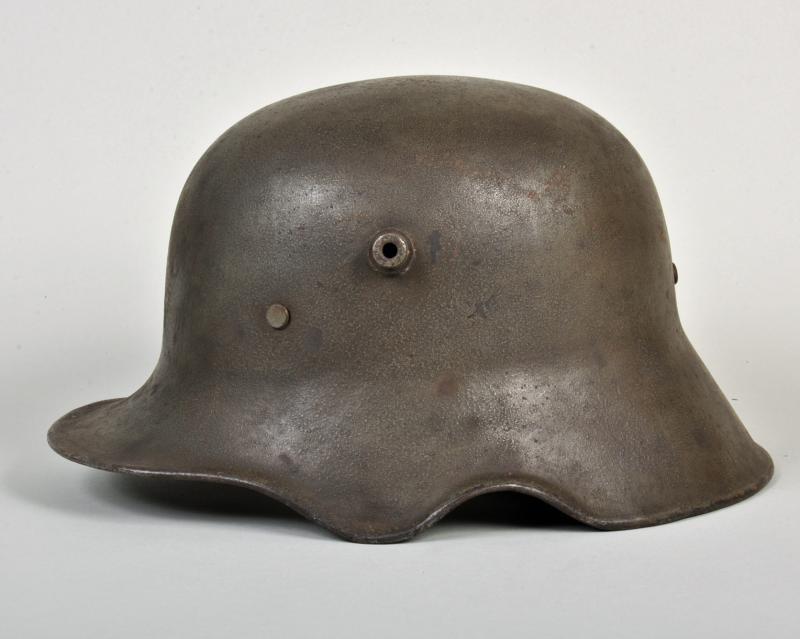 GERMAN WWI M.18 EAR CUT OUT HELMET.