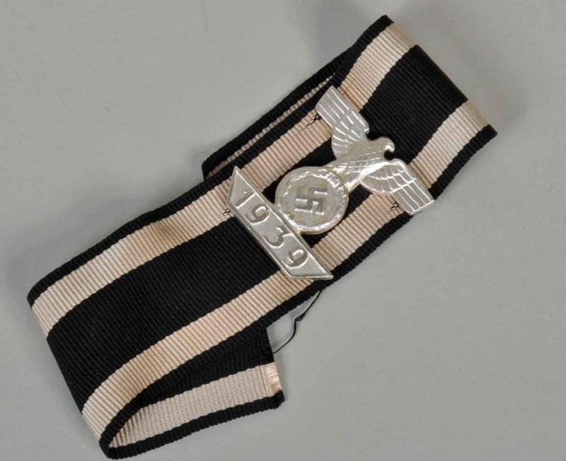 GERMAN WWII 2ND CLASS 1939 BAR TO THE 1914 IRON CROSS 2ND CLASS.