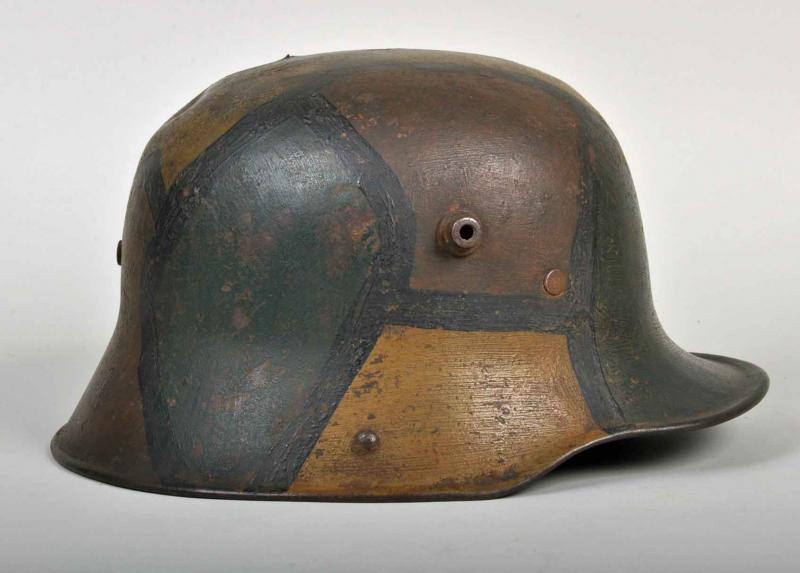 GERMAN WW I M.17 BATTLE DAMAGED CAMOUFLAGE HELMET.