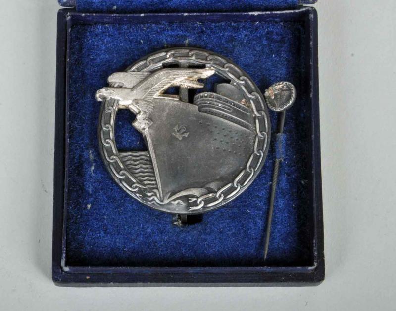 GERMAN WWII KRIEGSMARINE BLOCKADE BREAKER BADGE CASED WITH MINIATURE.