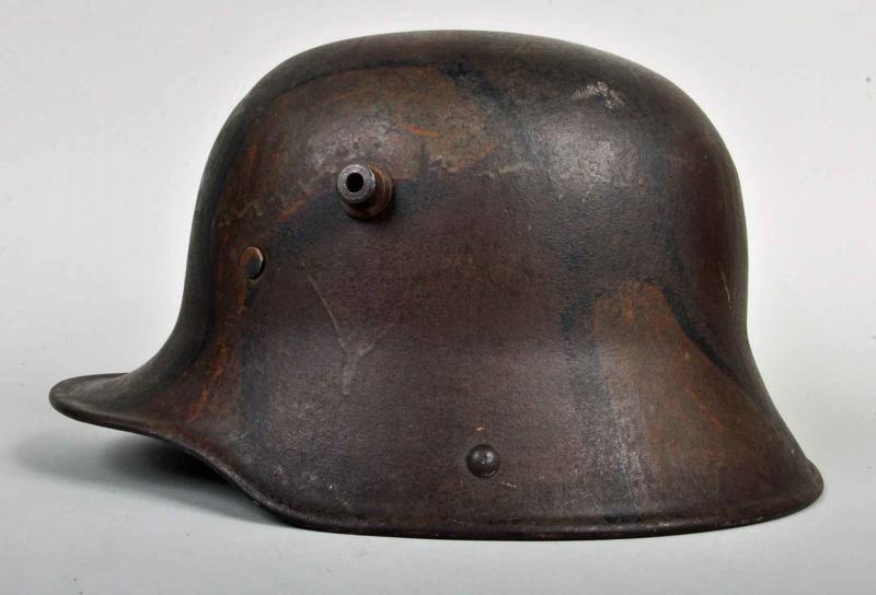 GERMAN WWI M.16 CAMOUFLAGE TRENCH HELMET.