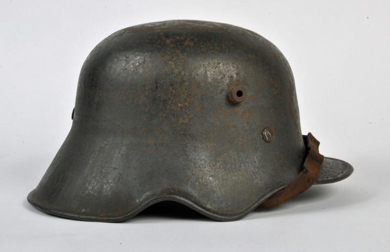 GERMAN WWI M.18 EAR CUT OUT HELMET.