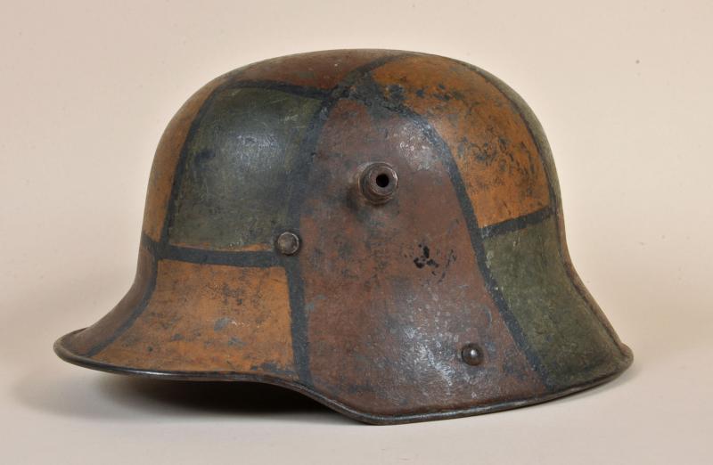 GERMAN WWI M.16 CAMOUFLAGE TRENCH HELMET.