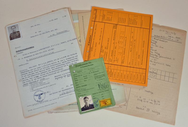 GERMAN WWII TOTENKOPF SERVICE PASS AND SERVICE RECORDS.