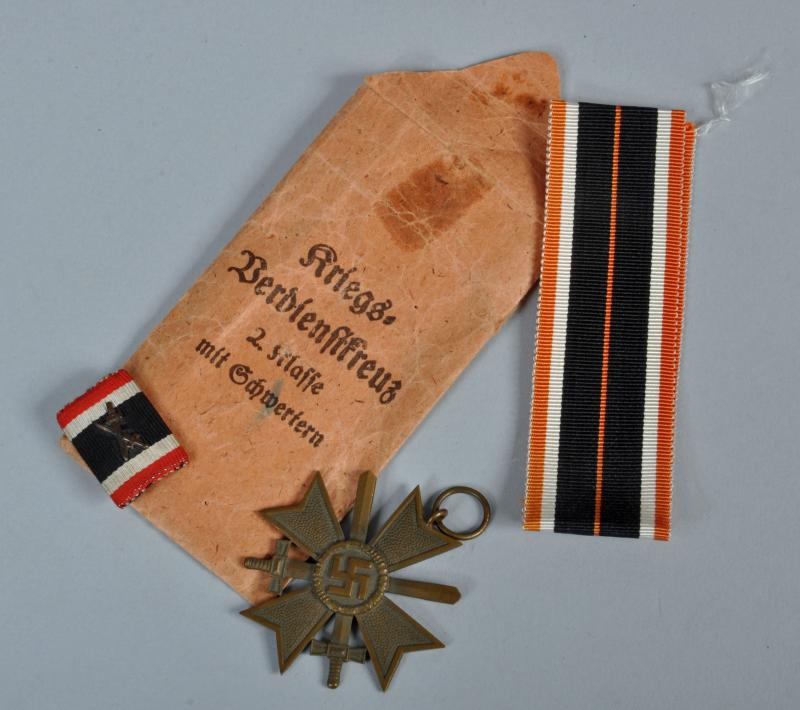 GERMAN WWII WAR SERVICE 2ND CLASS WITH SWORDS IN PACKET WITH MEDAL RIBBON BAR.