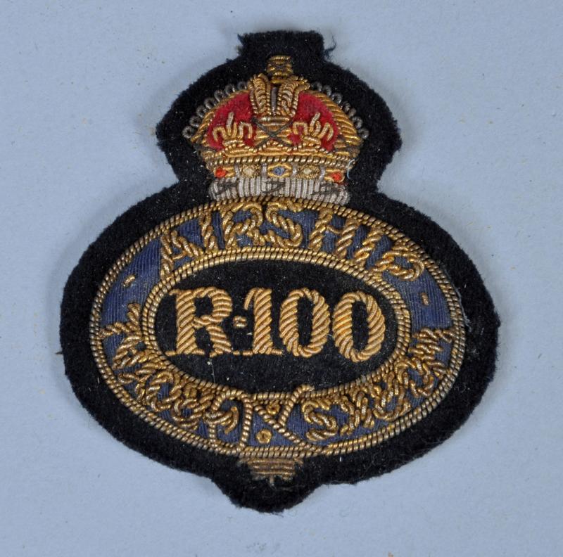 BRITISH WWI R100 AIRSHIP CAP BADGE.