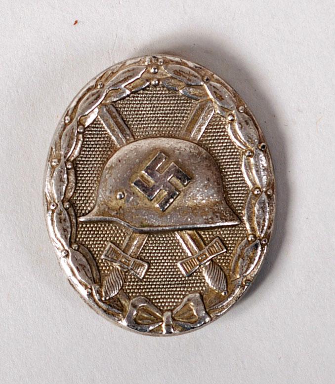 GERMAN WWII WOUND BADGE IN SILVER. MARKED 107