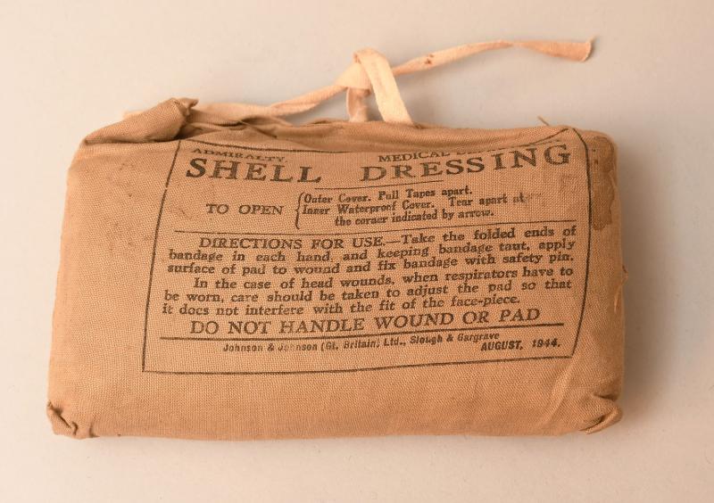 BRITISH  ADMIRALTY WWII SHELL DRESSING.