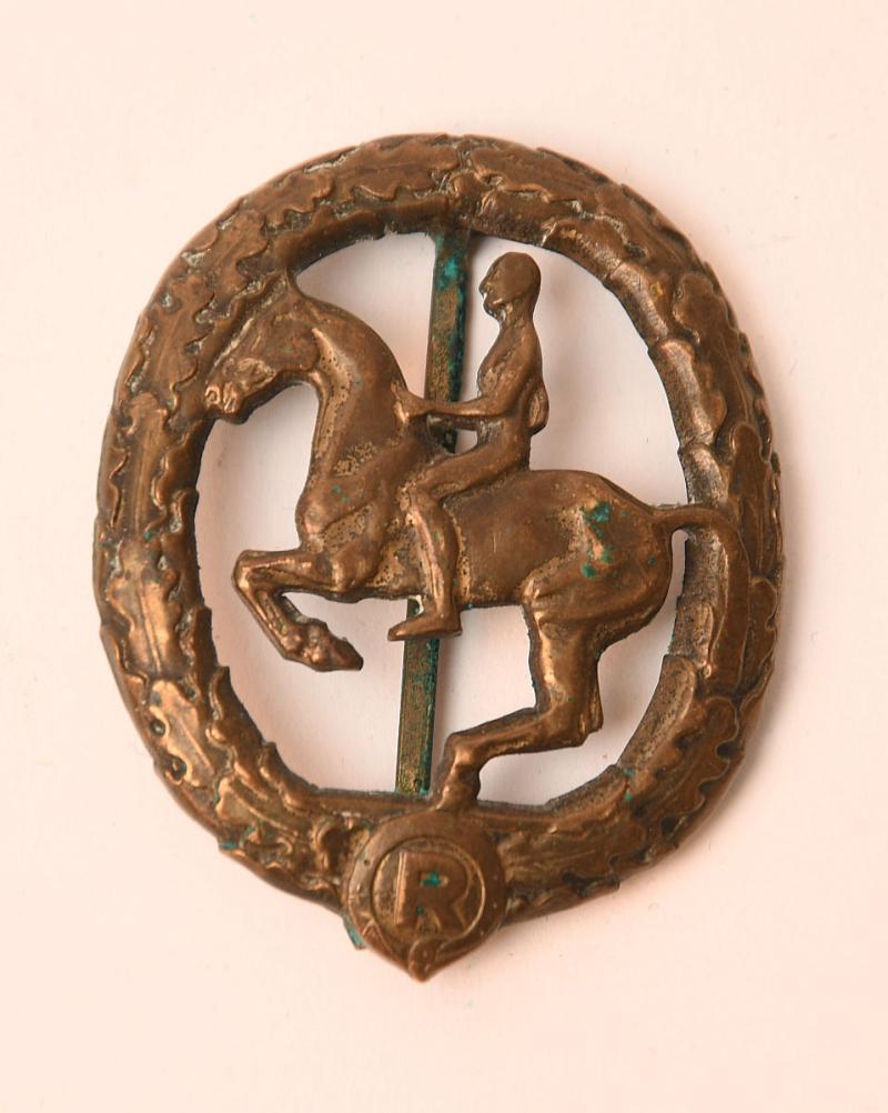 GERMAN WWII HORSERIDERS QUALIFICTION BADGE IN BRONZE. AS REMOVED FROM A SOUVENIR BELT.