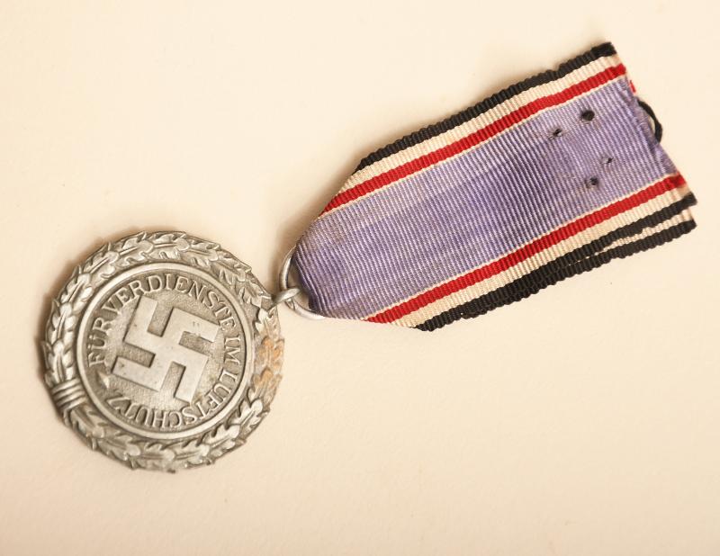 GERMAN WWII  LUFTSCHUTZ MEDAL WITH MAKER MARK.