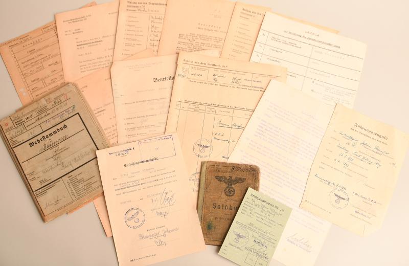 GERMAN WWII SOLDBUCH AND EXTENSIVE FILE DOCUMENTS TO A MEMBER OF THE INFANTRY REGIMENT 199 LIST.