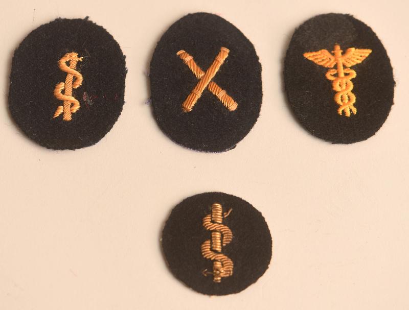 GERMAN WWII FOUR ITEMS OF KREIGSMARINE INSIGNIA.