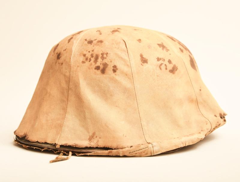 GERMAN WWII COMBAT HELMET WITH COVER.