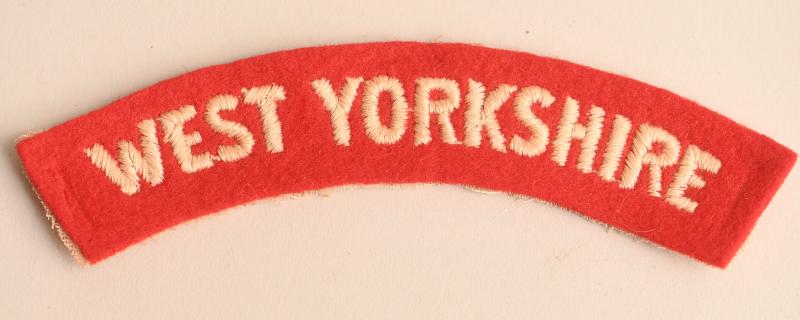 BRITISH WWII WEST YORKSHIRE REGIMENT SHOULDER TITLE.