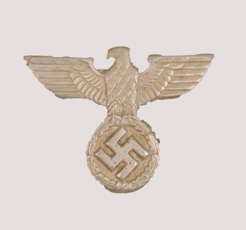 GERMAN WWII REICHPOST EAGLE IN WHITE METAL.