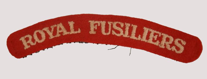 BRITISH WWII ROYAL FUSILIERS SHOULDER TITLE.