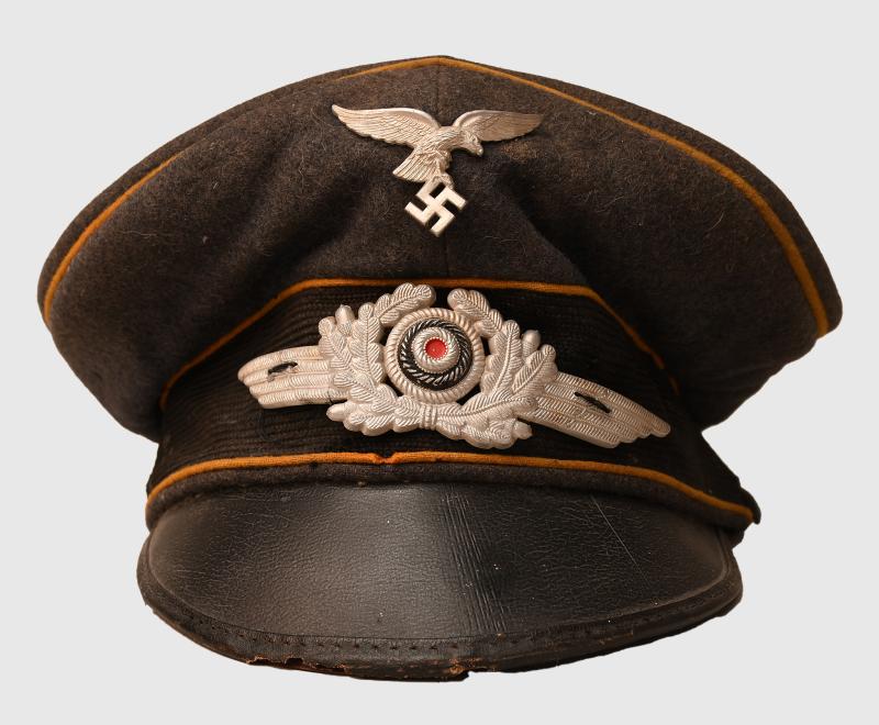 GERMAN WWII LUFTWAFFE PARATROOPER AND HERMAN GORING MARKED VISOR CAP.