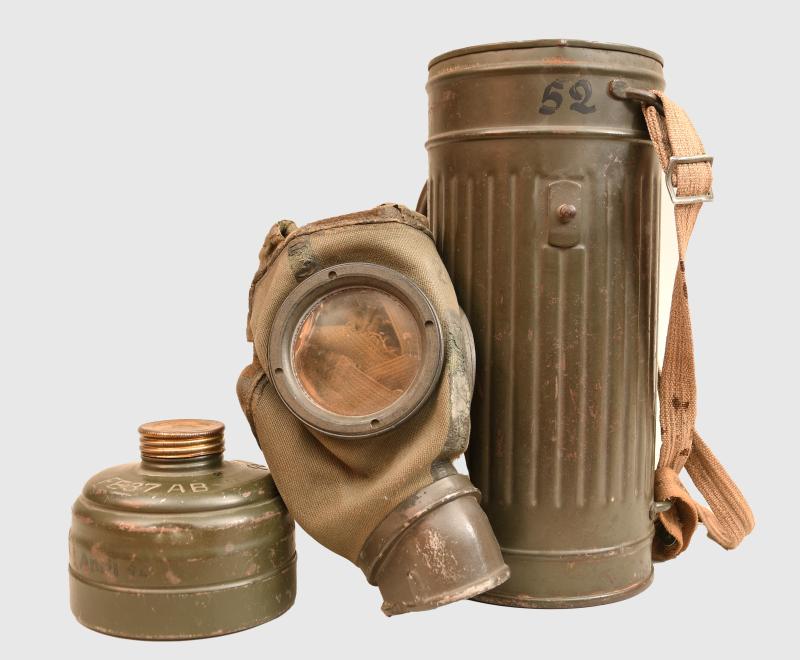 GERMAN WWII GAS MASK TIN WITH MASK.