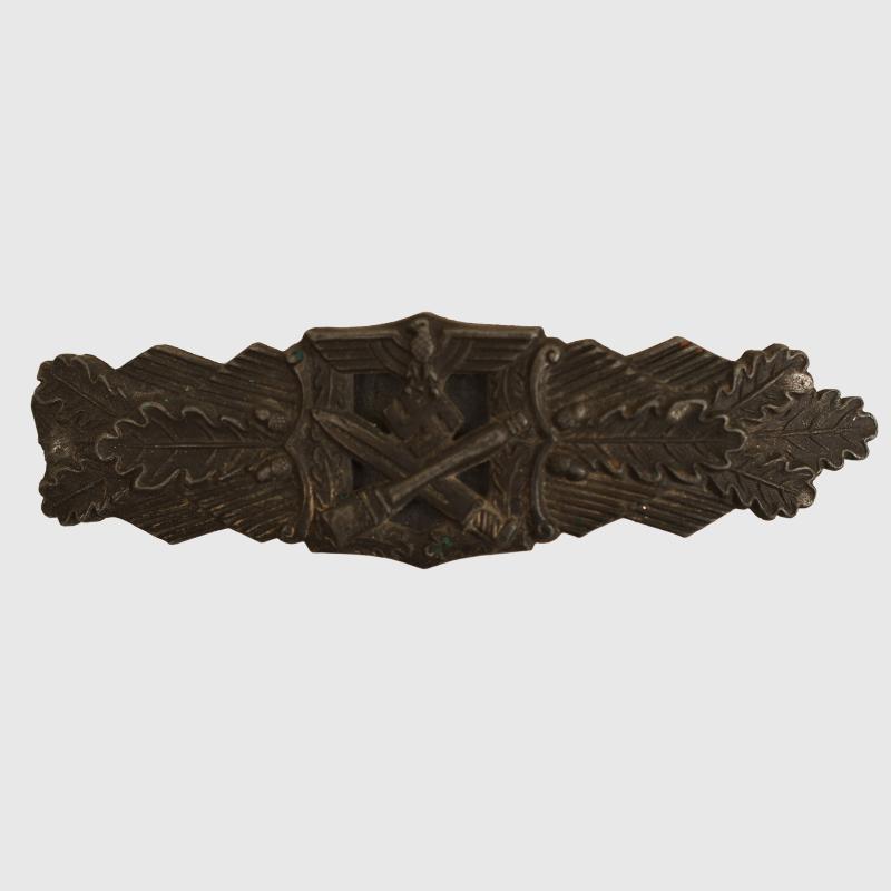 GERMAN WWII CLOSE COMBAT BAR IN BRONZE WITH MISSING TIP, AS REMOVED FROM A SOUVENIR BELT.