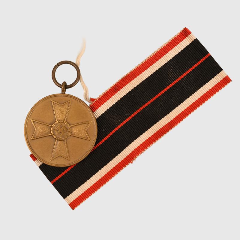 GERMAN WWII WAR MERIT MEDAL WITH ITS ORIGINAL RIBBON.