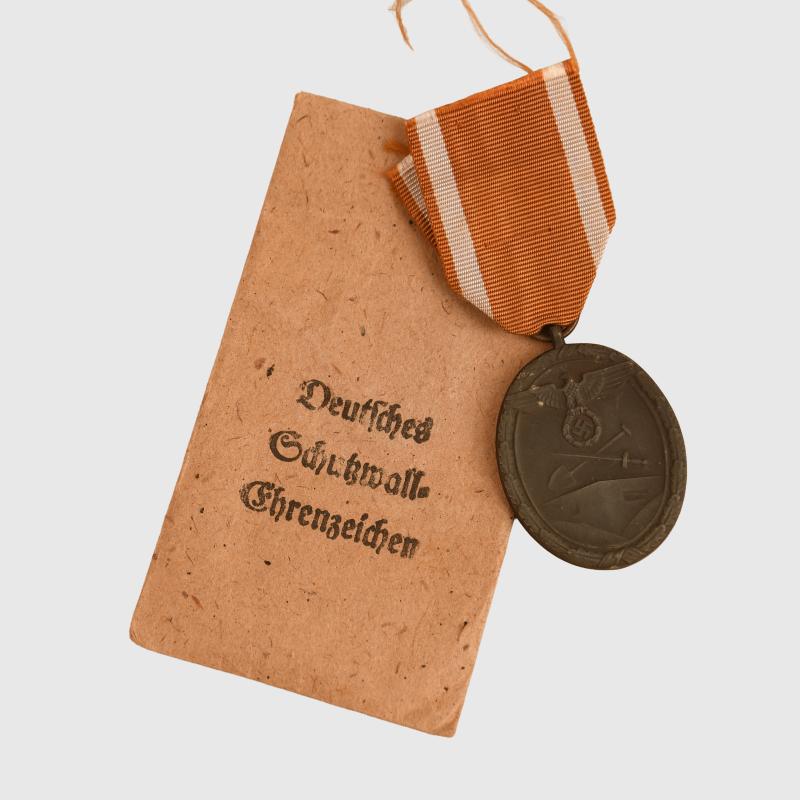 GERMAN WWII WEST WALL MEDAL IN ITS PACKET.