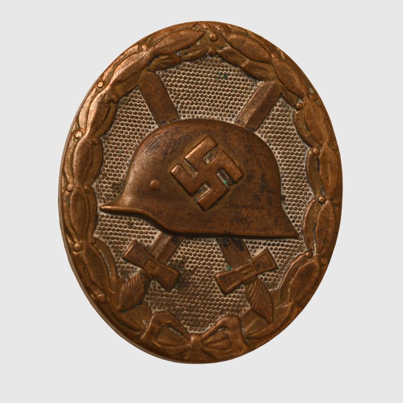 GERMAN WWII WOUND BADGE IN BLACK CONSTRUCTED IN BRASS. AS REMOVED FROM A SOUVENIR BELT.