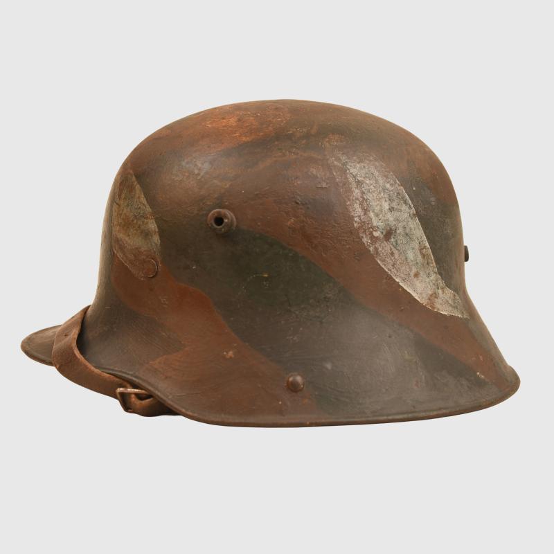 GERMAN WWI M.16 CAMOUFLAGE TRENCH HELMET.