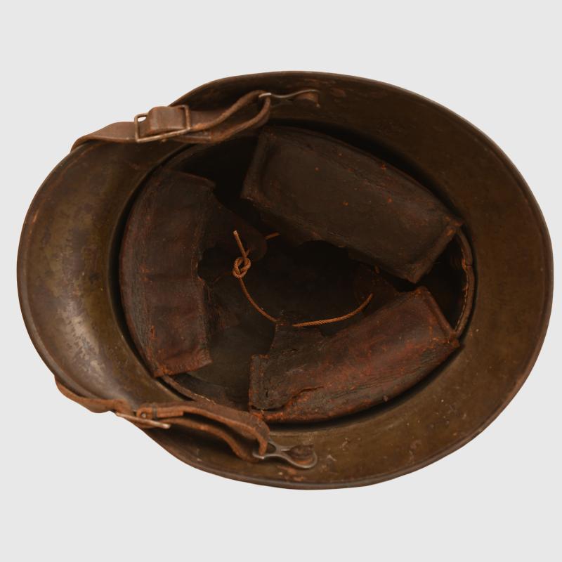 GERMAN WWI M.16 CAMOUFLAGE TRENCH HELMET.