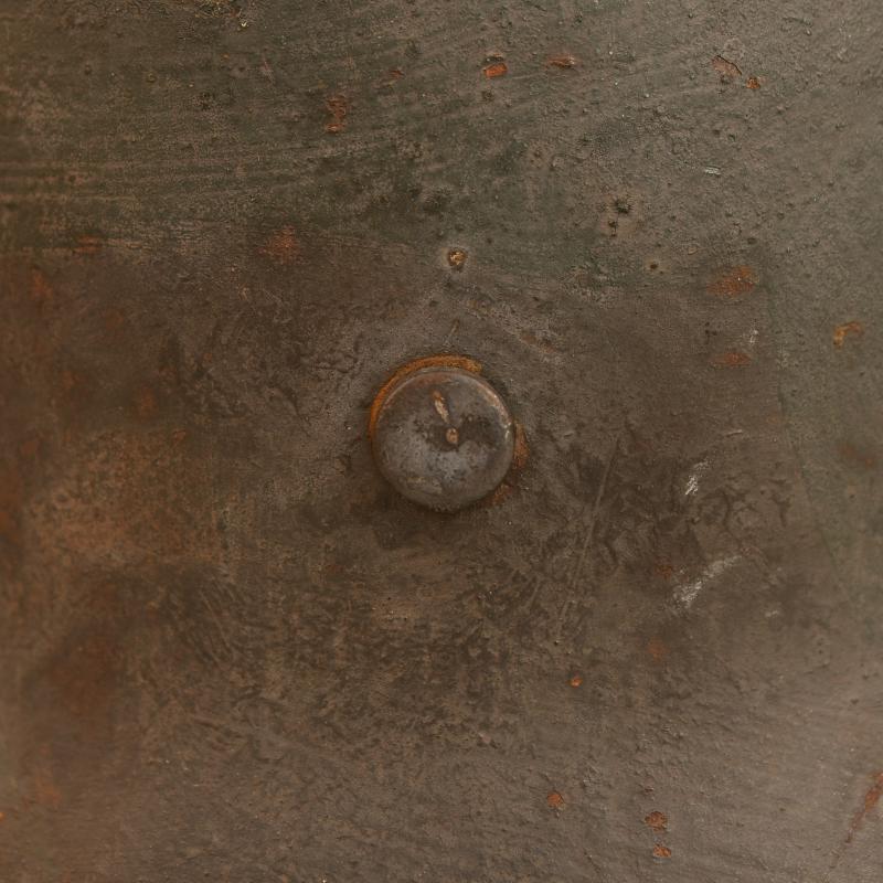 GERMAN WWI M.16 CAMOUFLAGE TRENCH HELMET.