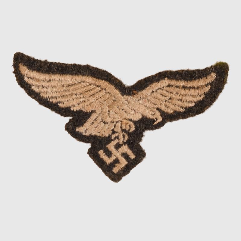GERMAN WWII LUFTWAFFE EARLY DROOP TAILED EAGLE FOR THE OVERSEAS CAP.