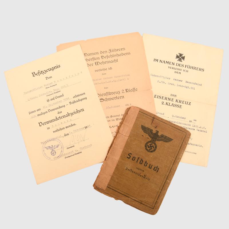 GERMAN WWII ARMY PANZER LEHR DIVISION CITATION AND SOLDBUCH SET.