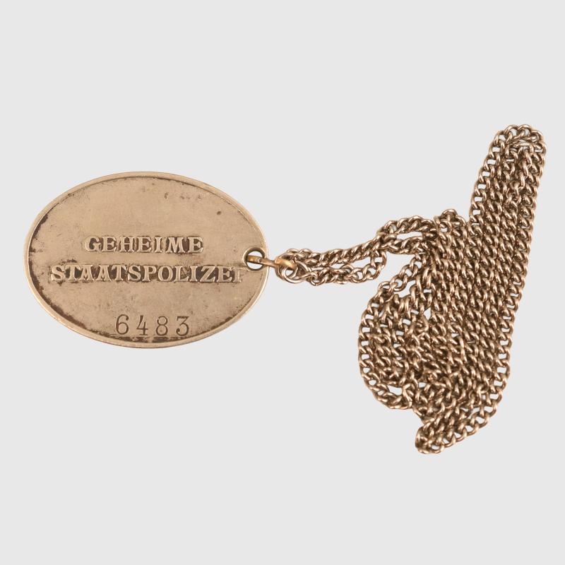 GERMAN WWII GEHEINE STAATSPOLIZEI (GESTAPO) WARRANT DISC.
