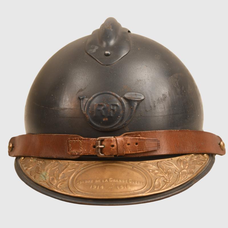 FRENCH WWI CHASSEURS ADRIAN HELMET WITH SOUVENIR PLATE.
