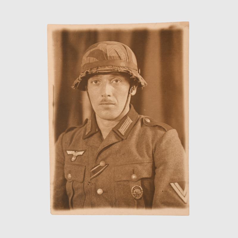 GERMAN WWII HELMET COVER PHOTOGRAPH.