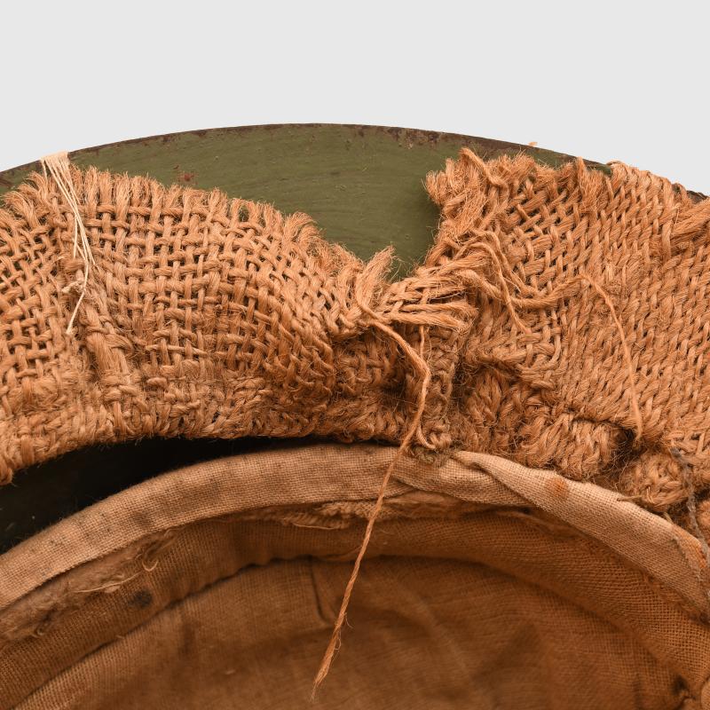 BRITISH WWI 1ST PATTERN BRODIE HELMET WITH A RARE TYPE OF SACKING COVER.
