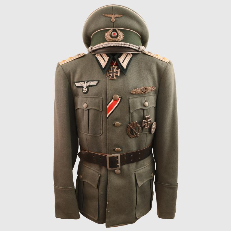 GERMAN WWII COMPLETE INFANTRY HAUPTMANN’S COMBAT TUNIC AND VISOR CAP WITH MEDALS ATTACHED AND BELT.