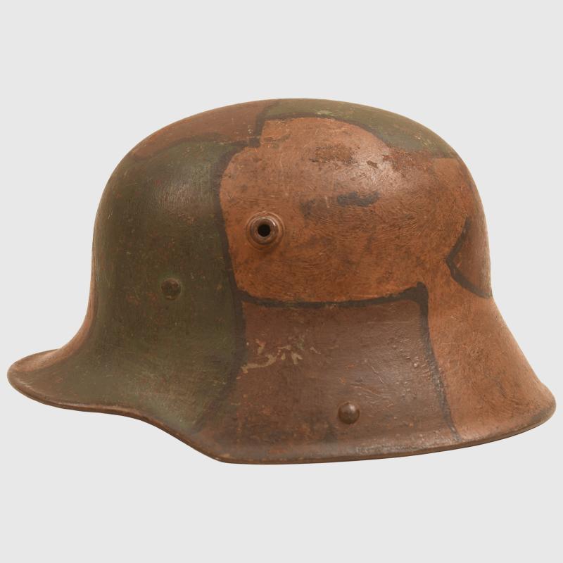 GERMAN WWI M.17 CAMOUFLAGE HELMET, COMPLETE WITH LINER AND THE RARE CHINSTRAP.