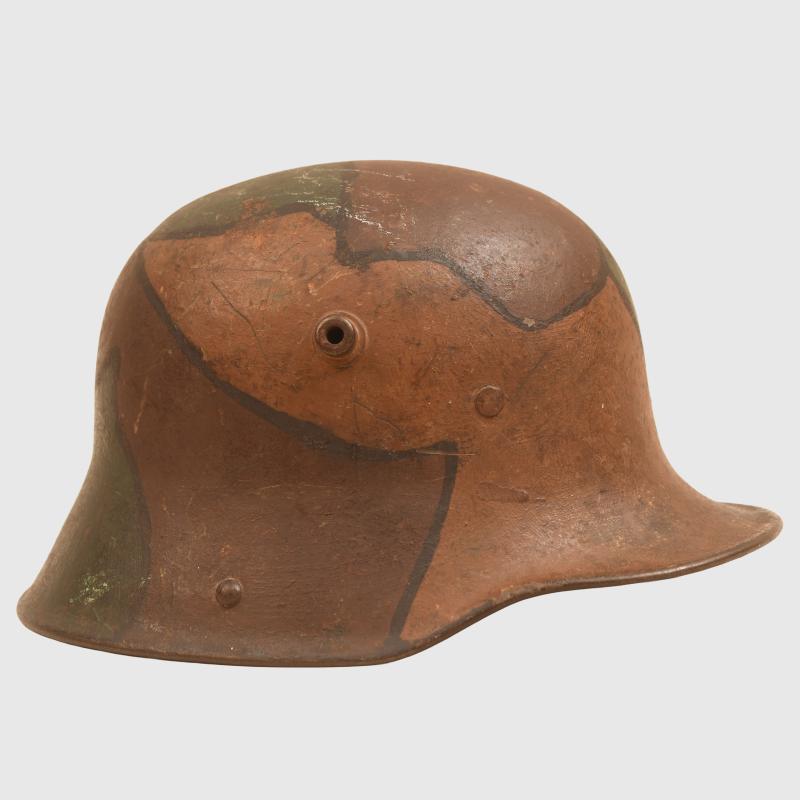 GERMAN WWI M.17 CAMOUFLAGE HELMET, COMPLETE WITH LINER AND THE RARE CHINSTRAP.