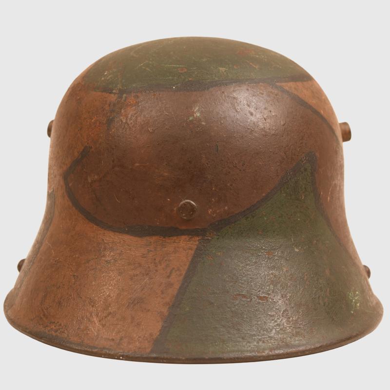 GERMAN WWI M.17 CAMOUFLAGE HELMET, COMPLETE WITH LINER AND THE RARE CHINSTRAP.