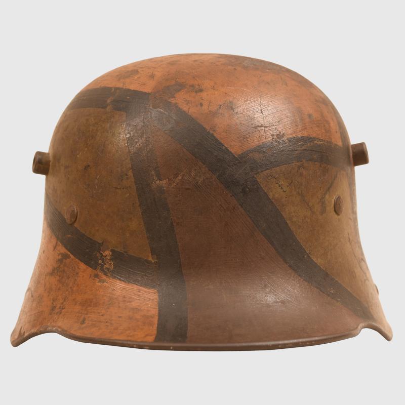 GERMAN WWI M.16 CAMOUFLAGE TRENCH HELMET WITH PARTIAL CHINSTRAP.