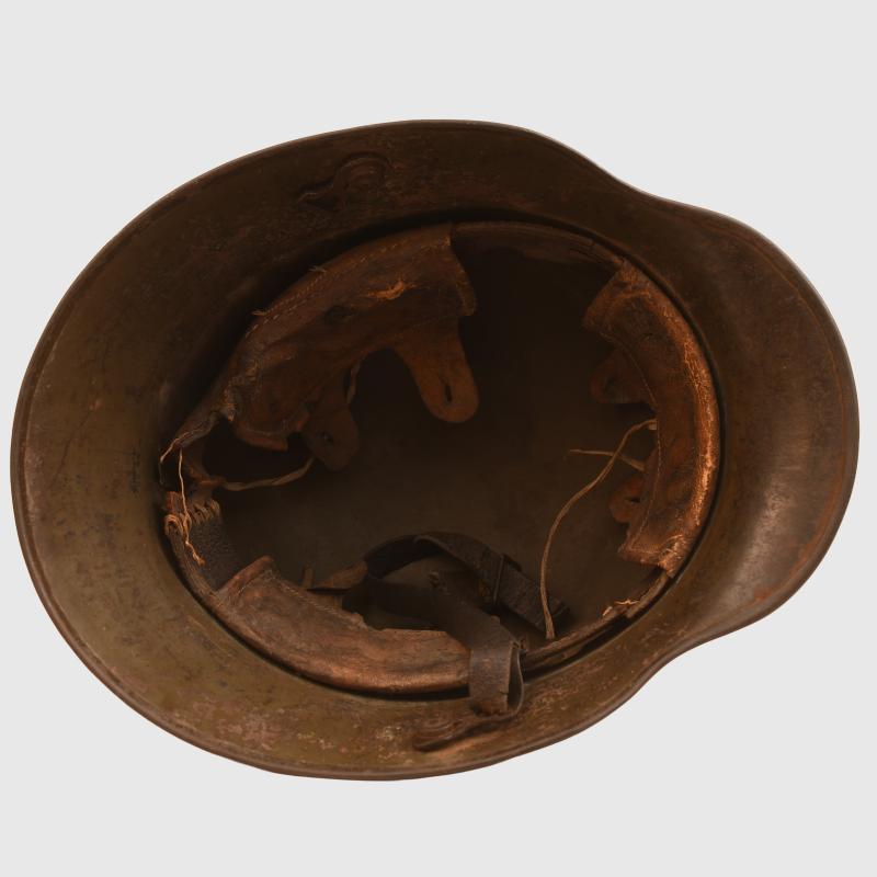 GERMAN WWI M.16 CAMOUFLAGE TRENCH HELMET WITH PARTIAL CHINSTRAP.