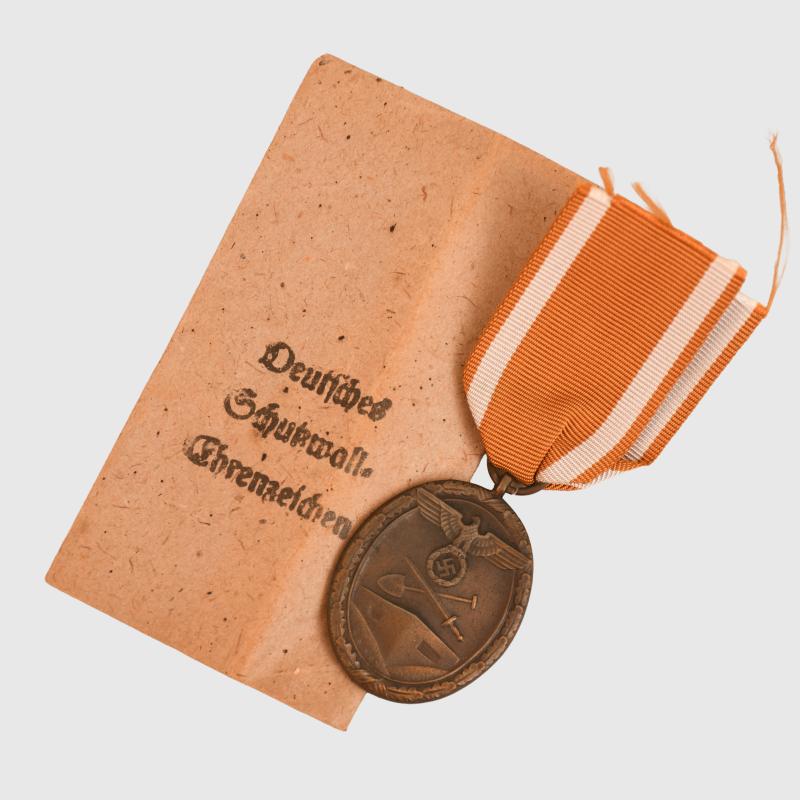 GERMAN WWII WEST WALL MEDAL IN ORIGINAL PACKET.