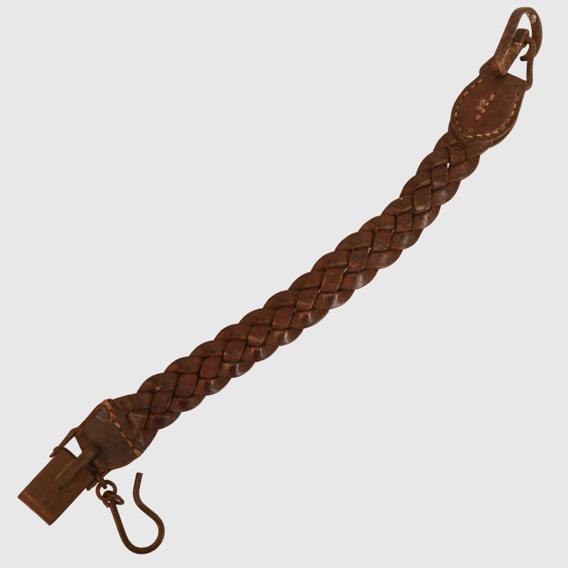 JAPANESE WWII LEATHER PLAIDED SWORD HANGER.