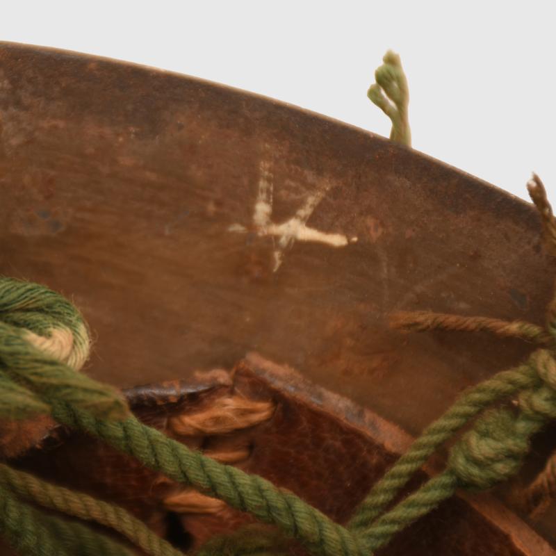 JAPANESE WWII TYPE 90 COMBAT HELMET WITH CAMOUFLAGE NET, IDENTIFIED TO AN INDIVIDUAL SOLDIER.